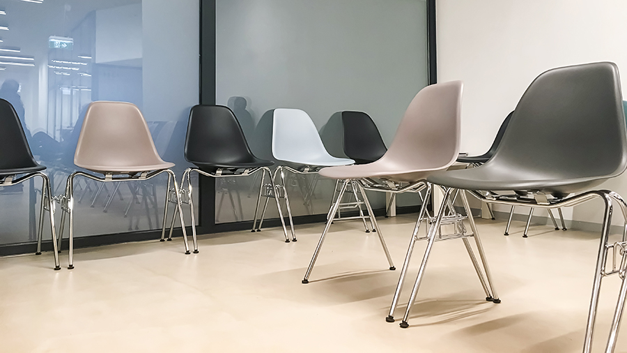 A group of chairs in a medical facility waiting room